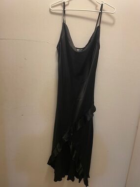 Minimalist Black Satin Midi Slip Dress with Asymmetric Ruffle